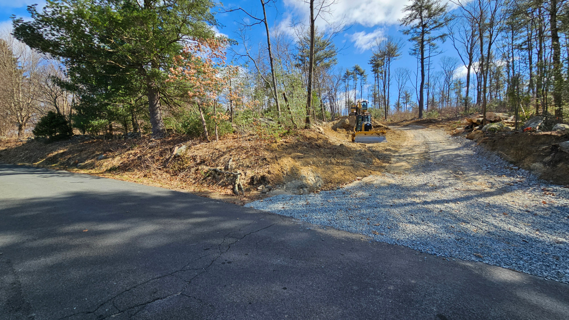 Gravel driveway and access-road construction on a wooded Western Massachusetts property
